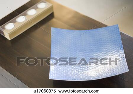 Stock Photography - Close-up of an aluminum sheet on a table. Fotosearch