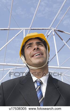 Close-up of an architect at a construction site View Large Photo Image Stock Photography - Close-up of an architect at a construction site. Fotosearch