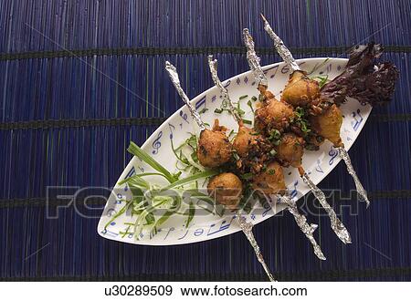 Stock Photo - Close-up of Indian appetizers on a platter. Fotosearch