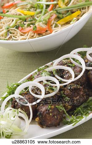 Close-up of Manchurian appetizers served with stir fried noodles View Large Photo Image Stock Photography - Close-up of Manchurian appetizers served with stir fried noodles. Fotosearch