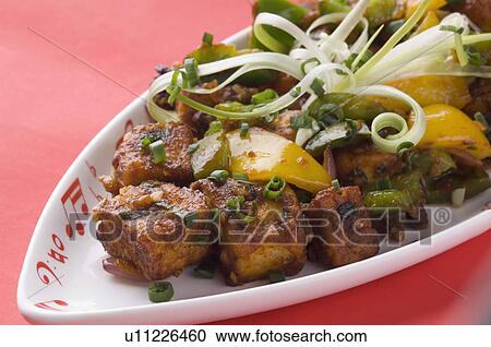 Close-up of stir fried cottage cheese cubes on a platter View Large Photo Image Stock Image - Close-up of stir fried cottage cheese cubes on a platter. Fotosearch