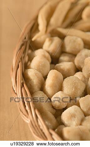 Close-up of sweets and cookies in a wicker basket View Large Photo Image Stock Photo - Close-up of sweets and cookies in a wicker basket. Fotosearch