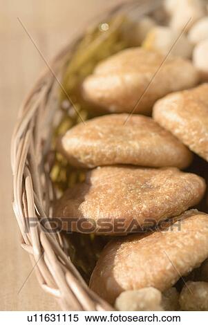 Close-up of sweets and cookies in a wicker basket View Large Photo Image Stock Photography - Close-up of sweets and cookies in a wicker basket. Fotosearch