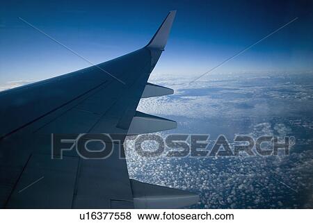 Close-up of the wing of an airplane View Large Photo Image Stock Photo - Close-up of the wing of an airplane. Fotosearch