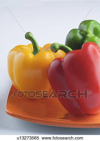 Close-up of three bell peppers on a plate View Large Photo Image Stock Photography - Close-up of three bell peppers on a plate. Fotosearch
