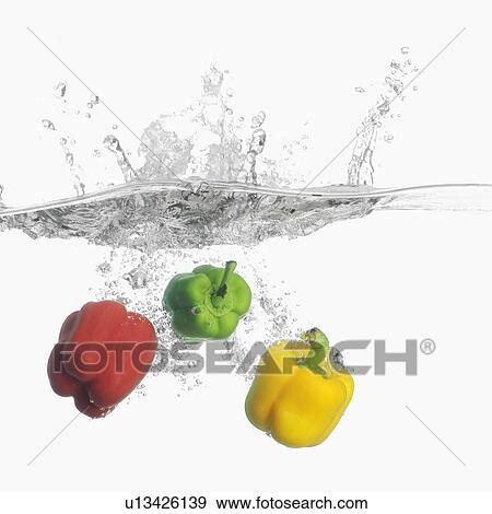 Close-up of three bell peppers underwater View Large Photo Image Stock Photo - Close-up of three bell peppers underwater. Fotosearch