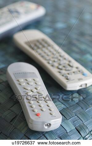 Close-up of three remote controls View Large Photo Image Stock Photo - Close-up of three remote controls. Fotosearch