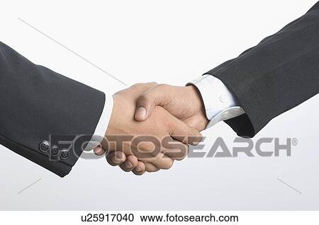Close-up of two businessmen shaking hands View Large Photo Image Stock Image - Close-up of two businessmen shaking hands. Fotosearch