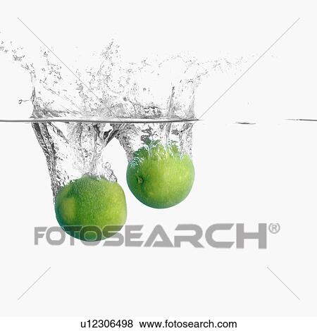 Stock Photo - Close-up of two limes underwater. Fotosearch