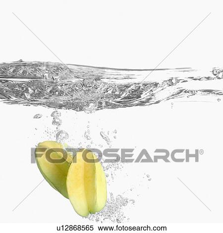 Stock Photography - Close-up of two starfruits underwater. Fotosearch