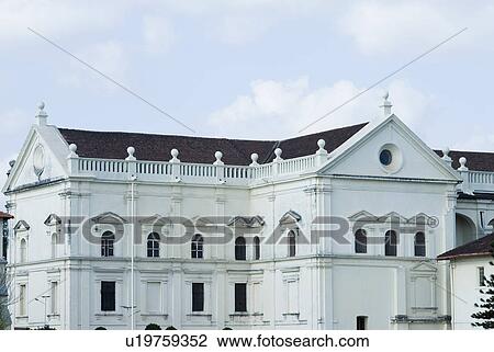 Stock Image - Clouds over a cathedral, Se Cathedral, Old Goa, Goa, India. Fotosearch