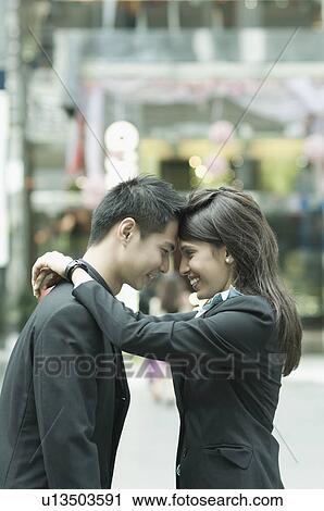 Couple in formal clothes embracing each other View Large Photo Image Stock Image - Couple in formal clothes embracing each other. Fotosearch