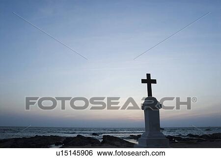Stock Photograph - Cross on the beach, Morjim Beach, Goa, India. Fotosearch