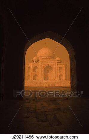 Stock Photograph - Facade of a mausoleum viewed through an arch, Taj Mahal, Agra, Uttar Pradesh, India. Fotosearch