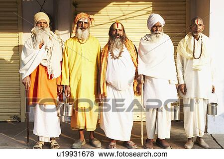 Stock Photo - Five sadhus standing side by side. Fotosearch
