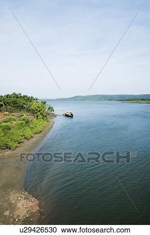 Stock Image - High angle view of a boat in a river, Chapora River, Goa, India. Fotosearch