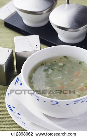 Stock Image - High angle view of a bowl of soup. Fotosearch