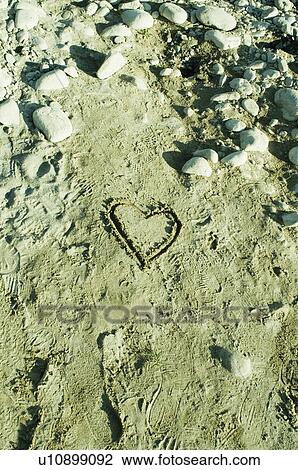 High angle view of heart shape drawn in sand View Large Photo Image Stock Image - High angle view of heart shape drawn in sand. Fotosearch