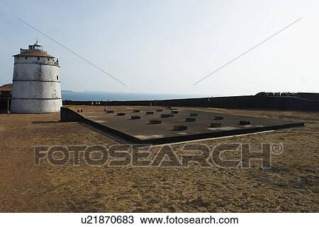 Stock Image - Lighthouse at a fort, Fort Aguada, Goa, India. Fotosearch