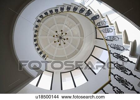 Picture - Low angle view of a spiral staircase. Fotosearch