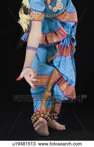 Low section view of a girl performing Bharatanatyam View Large Photo Image Stock Image - Low section view of a girl performing Bharatanatyam. Fotosearch