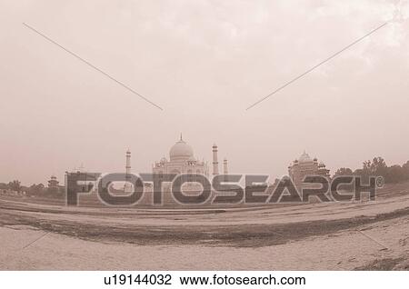 Stock Image - Mausoleum at the riverside, Taj Mahal, Agra, Uttar Pradesh, India. Fotosearch