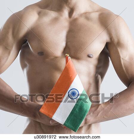 Mid section view of a young man holding an Indian flag View Large Photo Image Stock Image - Mid section view of a young man holding an Indian flag. Fotosearch