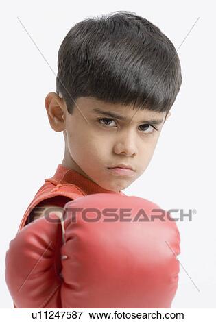 Stock Photo - Portrait of a boy calling for boxing. Fotosearch