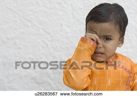 Stock Photo - Portrait of a boy crying. Fotosearch