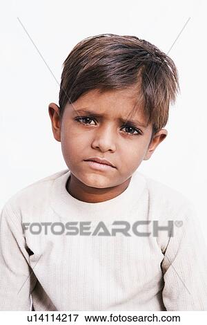 Portrait of a boy looking sad View Large Photo Image Stock Photo - Portrait of a boy looking sad. Fotosearch