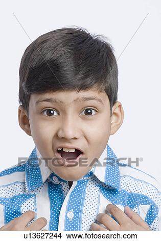 Picture - Portrait of a boy looking surprised. Fotosearch