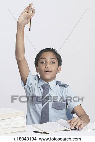 Portrait of a boy raising his hand View Large Photo Image Picture - Portrait of a boy raising his hand. Fotosearch
