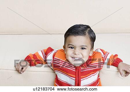Picture - Portrait of a boy smiling. Fotosearch