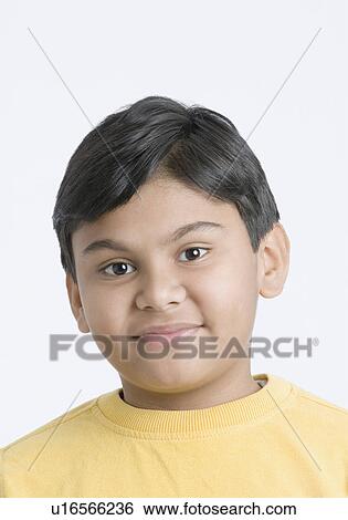 Stock Photograph - Portrait of a boy smirking. Fotosearch