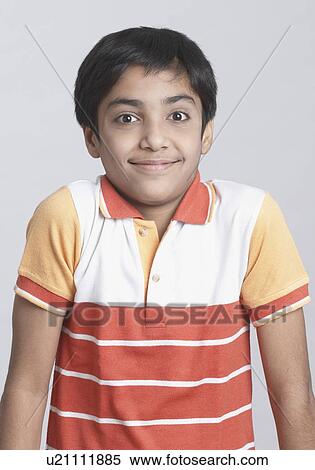Portrait of a boy smirking View Large Photo Image Stock Photography - Portrait of a boy smirking. Fotosearch