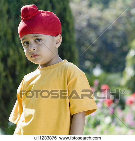 Stock Photograph - Portrait of a boy thinking. Fotosearch