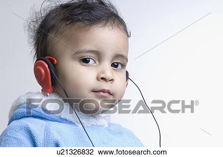 Portrait of a boy wearing headphones View Large Photo Image Stock Image - Portrait of a boy wearing headphones. Fotosearch