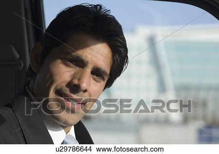 Portrait of a businessman in a car View Large Photo Image Picture - Portrait of a businessman in a car. Fotosearch