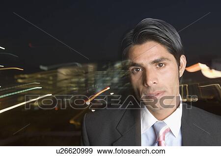 Stock Photo - Portrait of a businessman looking serious. Fotosearch