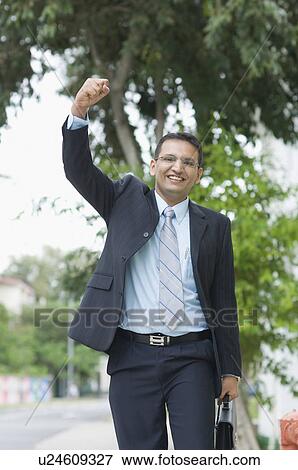 Stock Photo - Portrait of a businessman smiling. Fotosearch