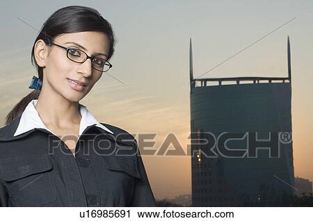 Portrait of a businesswoman wearing eyeglasses View Large Photo Image Stock Image - Portrait of a businesswoman wearing eyeglasses. Fotosearch