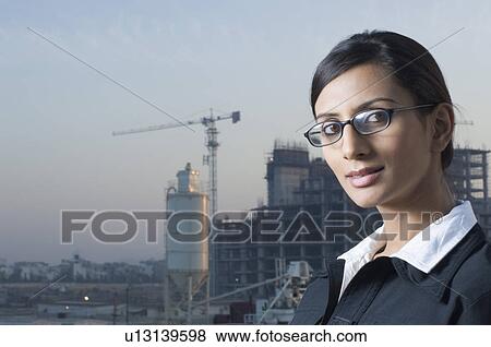 Portrait of a businesswoman wearing eyeglasses View Large Photo Image Stock Photo - Portrait of a businesswoman wearing eyeglasses. Fotosearch