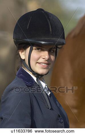 Portrait of a female jockey smiling View Large Photo Image Stock Photograph - Portrait of a female jockey smiling. Fotosearch
