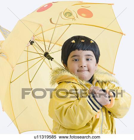 Stock Photography - Portrait of a girl holding an umbrella. Fotosearch
