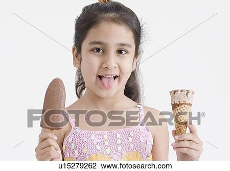 Portrait of a girl holding two ice creams View Large Photo Image Stock Image - Portrait of a girl holding two ice creams. Fotosearch