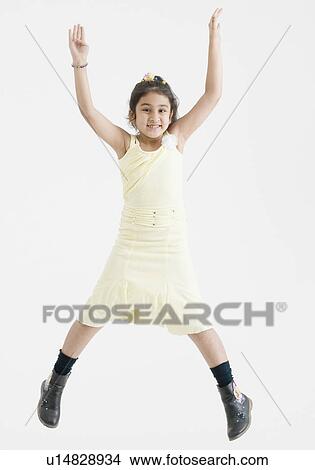 Picture - Portrait of a girl jumping. Fotosearch