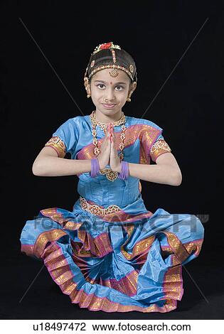 Stock Image - Portrait of a girl performing Bharatanatyam. Fotosearch