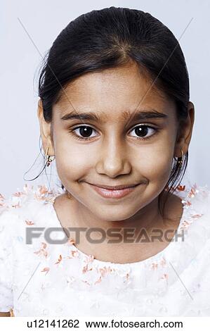 Stock Image - Portrait of a girl smiling. Fotosearch