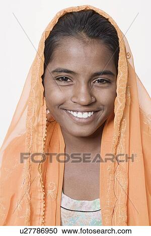 Stock Image - Portrait of a girl smiling. Fotosearch