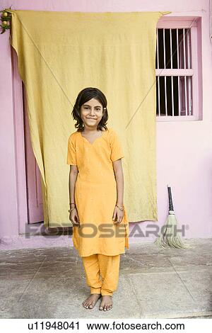 Portrait of a girl standing and smiling View Large Photo Image Stock Image - Portrait of a girl standing and smiling. Fotosearch